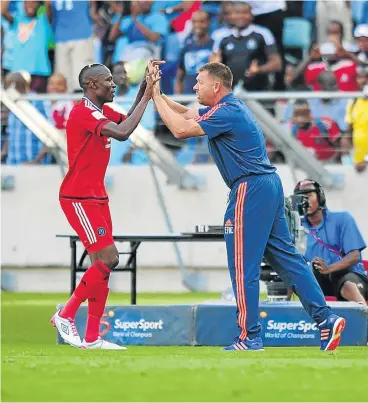  ?? Picture: BACKPAGEPI­X ?? ON THE DOUBLE: Two-goal hero Tendai Ndoro of Pirates celebrates with coach Eric Tinkler yesterday