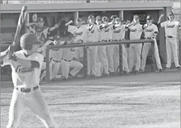  ??  ?? The Heritage bench gets into the action, trying to rattle a Northwest pitcher during the second game of their Region 6-AAAA series last week. (Photo by Scott Herpst)