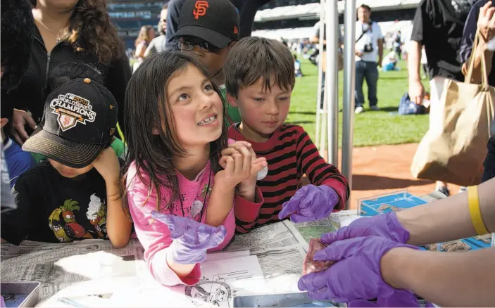  ?? UCSF ?? Discovery Day at AT&T Park, above, on Nov. 1, is the festival’s biggest draw with more than 200 interactiv­e exhibits and activities.