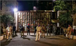  ??  ?? Police personnel guard outside industrial­ist Mukesh Ambani's residence Antilla after explosives were found in an abandoned car in its vicinity, in Mumbai. — PTI