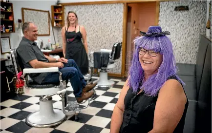  ?? GRANT MATTHEW/FAIRFAX NZ ?? Wendy Ashton Brougham Hair and Gifts owner (front), with husband Pierre Ashton and staff member Natalia Voyle turned Monday’s profits over to the New Zealand Epilepsy Foundation as part of the worldwide Purple Day campaign.