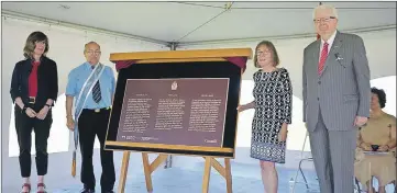  ?? LAWRENCE POWELL ?? Historic Sites and Monuments Board of Canada chairman Dr. Richard Alway, right, presided over the unveiling of a trilingual commemorat­ive plaque at Fort Anne June 22. The fort was the first administer­ed National Historic Site in Canada and turns 100...