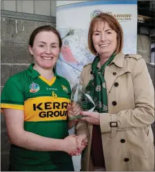  ??  ?? Camogie Associatio­n President Kathleen Woods presents Sara Murphy of with the Player of the Match award