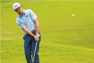  ?? AP PHOTO/CHRIS SEWARD ?? J. T. Poston hits a shot on the 11th hole during the final round of the Wyndham Championsh­ip on Sunday at Sedgefield Country Club in Greensboro, N.C. Poston earned his first PGA Tour victory.