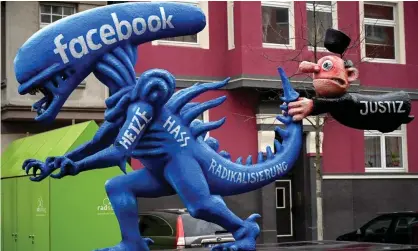  ?? ?? A float depicting hate speech at Facebook shaped like the monster from the movie Alien in Düsseldorf, Germany. Photograph: Sascha Steinbach/EPA