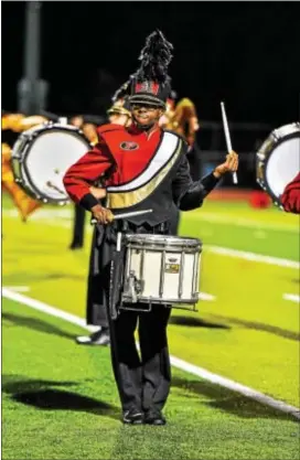  ??  ?? Chris Jackson performs on snare drum with the Penncrest High School marching band.