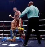  ??  ?? TOUGH BATTLE: Skoglund bloodies Smith’s nose [below], until the Liverpudli­an rallies [below right], drops him in the 11th round [above], and pounds his chest, satisfied with his work [right]