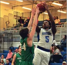  ?? BARBARA HALL / For the Calhoun Times ?? Gordon Central’s Quan Curtis (5) shoots over Murray County’s Lincoln Puryear during the second half on Thursday.