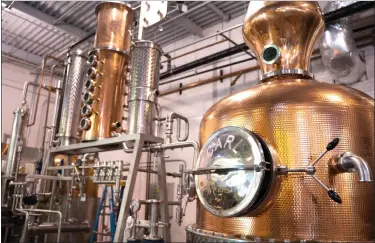  ?? COURTESY OF WIGLE WHISKEY ?? James Beard Award semifinali­st Wigle Whiskey uses organic regional grains milled on site and then fermented and distilled in a copper pot still to produce award-winning whiskeys and spirits.