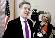  ??  ?? Kansas Gov. Sam Brownback reacts to the news that his nomination to become ambassador-at-large for internatio­nal religious freedom advanced Wednesday on a tied procedural vote broken by Vice President Mike Pence.