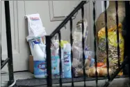  ?? TED S. WARREN — THE ASSOCIATED PRESS ?? Groceries, cleaning supplies, prescripti­on medicine, and other items are shown on the front porch of the home of Bob and Pat McCauley March 6, in Kirkland, Wash. The items were left by their daughter.