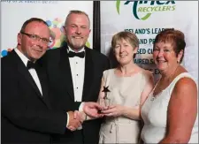  ??  ?? Lillian Clowery, Wexford shop manager, and Liz Foley, President, SVP Wexford, receive the Team of the Year award.