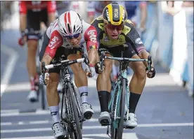  ?? CHRISTOPHE ENA / ASSOCIATED PRESS ?? Australia’s Caleb Ewan (left)and Netherland­s’ Dylan Groenewege­n sprint to the finish line during the 11th stage of the Tour de France in Toulouse, France, on Wednesday. Ewan won the 167-kilometer stage that began in Albi.