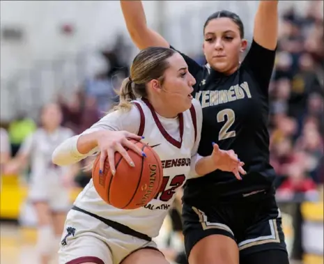  ?? JJ LaBella/For the Post-Gazette ?? Greensburg Central Catholic’s Mya Morgan goes up to shoot against Kennedy Catholic’s Bella Magestro during a PIAA Class 2A state semifinal on Monday at North Allegheny High School.