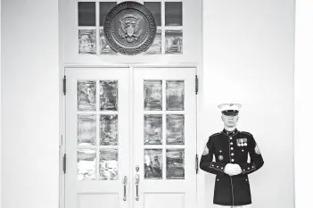  ?? SAUL LOEB/GETTY-AFP ?? A U.S. Marine stands guard outside the West Wing on Wednesday, indicating that President Trump is in the Oval Office.