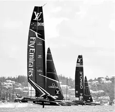  ??  ?? Emirates Team New Zealand extend their lead over Oracle Team USA in the Great Sound during the 35th America’s Cup in Hamilton, Bermuda. — AFP photo