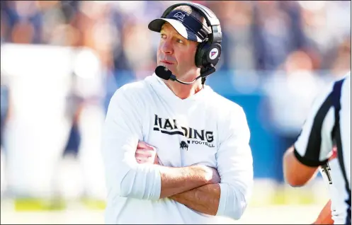  ?? (Special to the Democrat-Gazette/Chris Leduc) ?? Harding Coach Paul Simmons looks to the scoreboard Dec. 16 during the Division II national championsh­ip game between against Colorado School of Mines at McKinney ISD Stadium in McKinney, Texas.