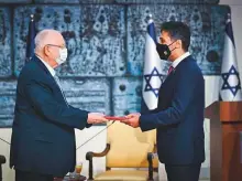  ?? Courtesy: Twitter ?? Mohammad Al Khaja presents his credential­s to Israeli President Reuven Rivlin at a ceremony in Jerusalem.