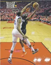  ?? DAVID J. PHILLIP/ASSOCIATED PRESS ?? Rockets guard James Harden, right, drives to the basket against Warriors forward Kevin Durant during Game 1 of the Western Conference Finals on Monday in Houston.