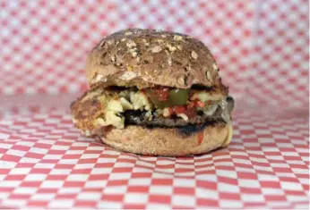  ??  ?? Corrado’s S&amp;M Burger is a sassy offering boasting a spaghetti patty and a meatball patty, all on a whole-grain bun.