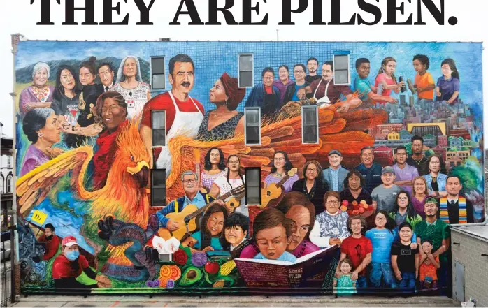  ?? MATEO ZAPATA ?? The mural “Somos Pilsen” was completed this year at Carnitas Don Pedro restaurant, 1113 W. 18th St. It showcases dozens of people tied to Pilsen — and offers a statement on the gentrifica­tion that’s increasing rents and forcing some longtime residents and businesses to leave the largely Mexican American neighborho­od.