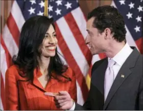  ?? CHARLES DHARAPAK — THE ASSOCIATED PRESS ?? In this photo taken then-New York Rep. Anthony Weiner and his wife, Huma Abedin, an aide to then-Secretary of State Hillary Clinton, are pictured after a ceremonial swearing in of the 112th Congress on Capitol Hill in Washington. Democratic...