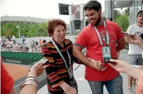  ?? AP ?? Marco Trungellit­i’s grandmothe­r, Dafne Botta, and his brother, Andre, speak to reporters at Roland Garros yesterday.