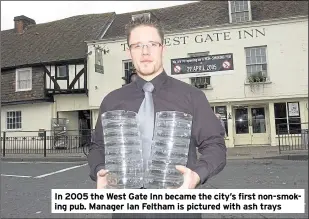  ??  ?? In 2005 the West Gate Inn became the city’s first non-smoking pub. Manager Ian Feltham is pictured with ash trays