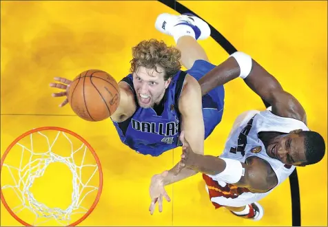  ?? REUTERS FILE ?? Dallas Mavericks' Dirk Nowitzki outduels Chris Bosh of the Miami Heat during the 2011 NBA Finals in Miami.