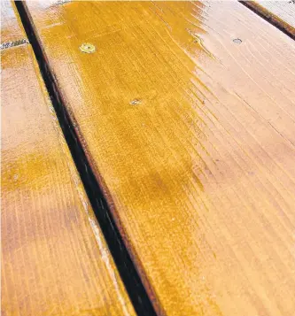  ?? STEVE MAXWELL ?? Translucen­t film-forming deck finishes like this Sikkens DEK look fabulous for two to four years. Stripping back to bare wood after this is usually necessary to renew finishes like this.