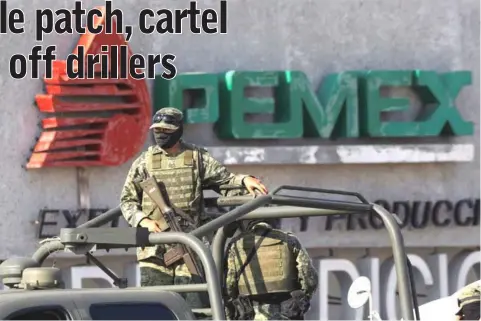  ??  ?? Soldiers keep guard a gas facility of Pemex in Reynosa. In April, a Pemex security worker guarding installati­ons against fuel thieves was killed and another was shot in an ambush in the Tamaulipas city of Matamoros after gunmen fired some 60 rounds into a vehicle. — Reuters photo