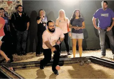  ?? Pin Lim / For the Chronicle ?? Ben Hanson bowls during a Major League Bocce gathering at Brooklyn Athletic Club, 601 Richmond Ave. in Midtown. Games last about 45 minutes and the players usually stay late to socialize.