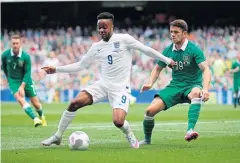  ?? AP ?? England’s Raheem Sterling, left, shields the ball from Republic of Ireland’s Robbie Brady.