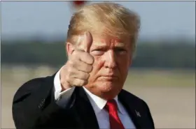  ?? ALEX BRANDON — THE ASSOCIATED PRESS ?? President Donald Trump gives thumbs up as he steps off Air Force One as he arrives Monday at Andrews Air Force Base, Md. Trump is returning from Orlando, Fla.