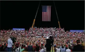  ?? (AP/Nell Redmond) ?? President Donald Trump speaks at a campaign rally Wednesday night at the airport in Gastonia, N.C. Trump spoke about his public feud with “60 Minutes” correspond­ent Lesley Stahl, who he says took him too seriously after he pleaded for suburban women to love him. Trump said although he was kidding, “I mean it.”