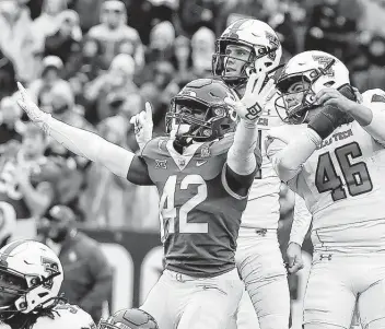  ?? Jerry Larson / Associated Press ?? Baylor safety Jairon McVea (42) reacts as Texas Tech kicker Jonathan Garibay (46) watches his field-goal attempt miss in the final seconds of Saturday’s game at McLane Stadium in Waco.