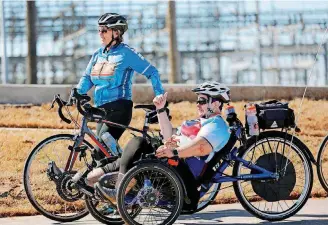  ?? [PHOTOS BY JIM BECKEL, THE OKLAHOMAN] ?? After a ceremony marking the completion of MAPS 3 Will Rogers Trail, cyclists rode the trail east of May between Interstate 40 and the Oklahoma River.