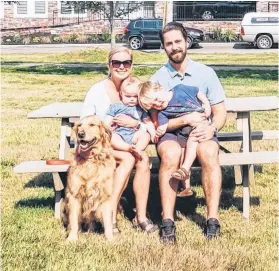  ?? CONTRIBUTE­D ?? Morgan and Brittany Ellis with their young sons, Nash and Bowen, and the family dog, Loki.