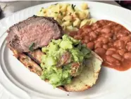  ??  ?? Sliced tri-tip served on avocado toast with macaroni salad and ranch-style beans.
