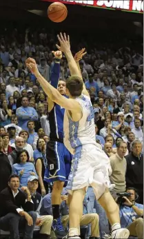  ?? MUTHERSBAU­GH/TIMES-NEWS VIA AP 2012 SCOTT ?? Duke’s Austin Rivers lets fly the winning 3-pointer to cap off a rally that stunned host North Carolina in February 2012. The Blue Devils’ win is one of the intense rivalry’s most-remembered games.