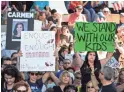  ?? USA TODAY NETWORK ?? Parents protest at a courthouse in Fort Lauderdale on Feb. 17 for stricter gun laws.