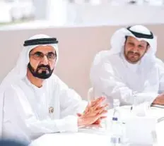  ?? WAM ?? Shaikh Mohammad Bin Rashid discussing government strategies with officials during a session.