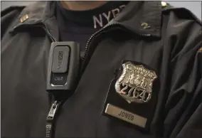  ?? MARK LENNIHAN — THE ASSOCIATED PRESS FILE ?? New York Police Department officer Joshua Jones wears a VieVu body camera on his chest during a news conference in New York.