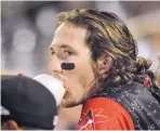  ?? JIM THOMPSON/JOURNAL ?? Isotopes left fielder Drew Weeks works on his bubble gum from the dugout during the home game against San Antonio on Friday night.