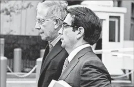  ?? ZORAN MILICH/ REUTERS PHOTO ?? Paul Konigsberg, left, leaves court with his lawyer Reed Brodsky after making bail. Konigsberg was arrested Thursday and charged with conspiracy and falsifying records.