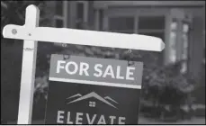  ?? ASSOCIATED PRESS ?? A for sale sign appears outside a condominiu­m complex on Monday in Denver. The average rate on a 30-year mortgage dropped to 6.6% from 6.66% last week, mortgage buyer Freddie Mac reported Thursday.