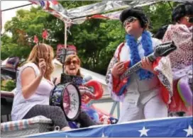  ?? ANNE NEBORAK — DIGITAL FIRST MEDIA ?? One of the floats at the 2016 East Lansdowne Parade featured impersonat­ors. Elvis’