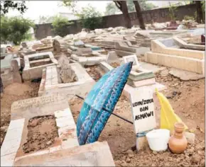  ?? RONY ZAKARIA/THE NEW YORK TIMES ?? The grave of Muhammad al-Zahra, who was lynched by a mob after being accused of stealing, in Bekasi, Indonesia, on August 14.