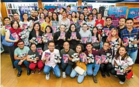  ?? —LEO M. SABANGANII ?? BOOK EVENT Inquirer Opinion editor Gibbs Cadiz, Super editor Pam Pastor and Inquirer Books editor Ruel S. De Vera pose with contributo­rs to “Young Blood 7, ”which was launched at National Book Store in Shangri-La Plaza on Saturday.