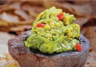  ?? Express-News file photo ?? Guacamole’s 500-plus year history starts in Central Mexico with avocados, salt and tomatoes.